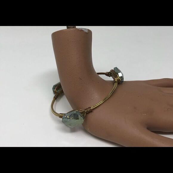 Gold tone wire wrap bracelet with blue glass stones. - Picture 1 of 5